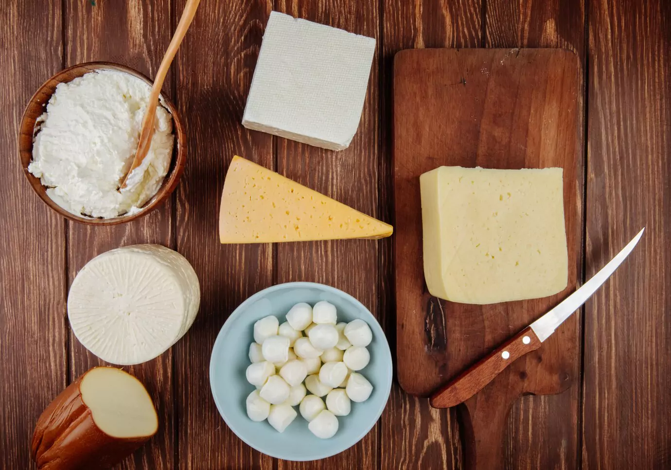 top-view-different-kind-cheese-rustic-wooden